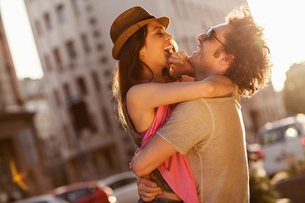 happy-young-couple-hugging-in-public