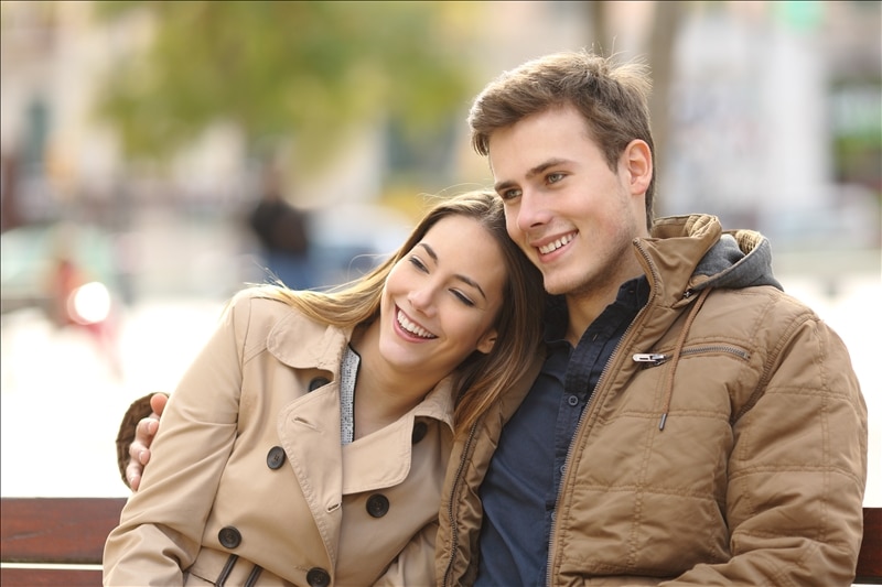 couple-hugging-in-a-public-park