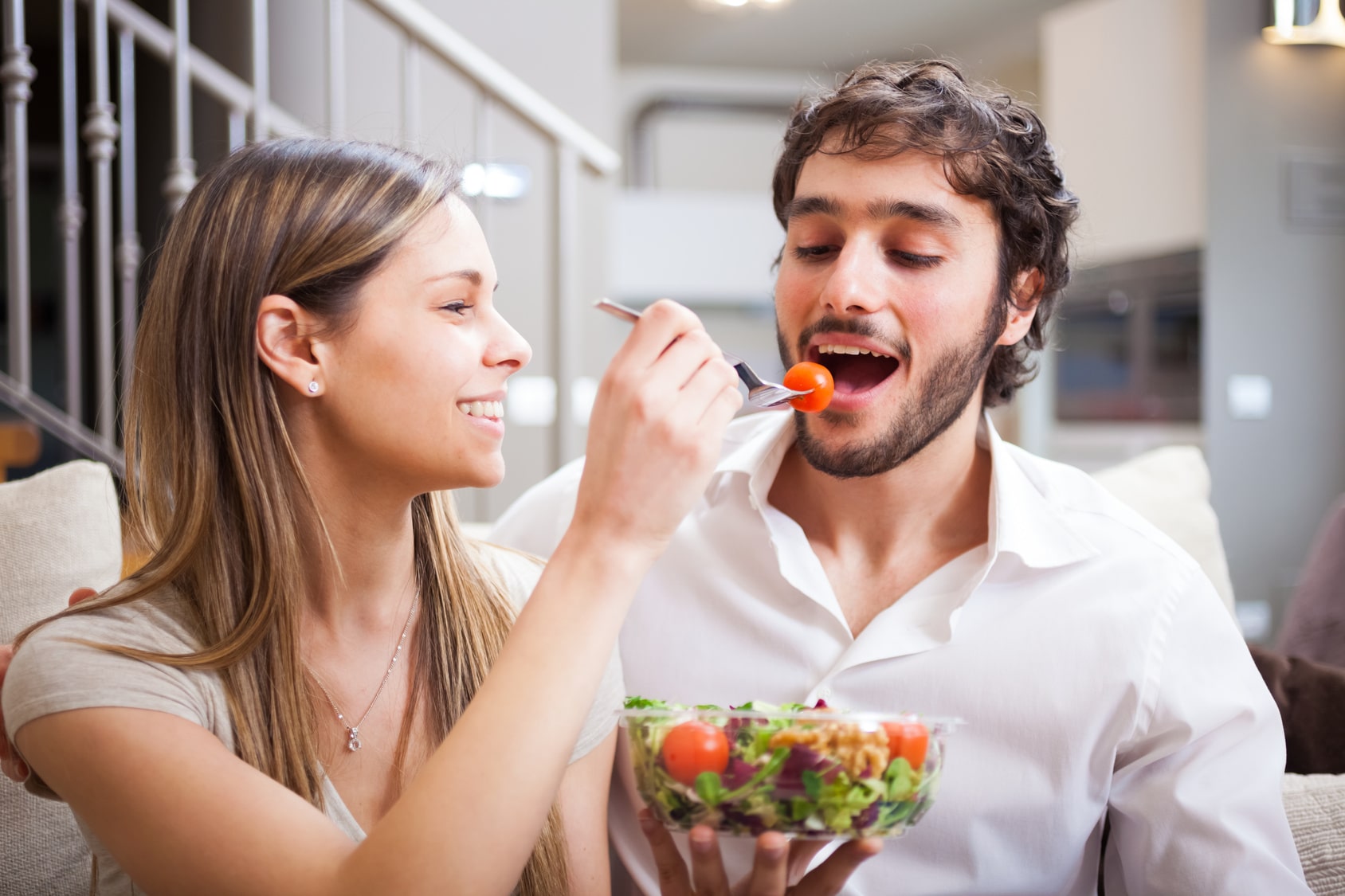 Couple eating a salad on a date